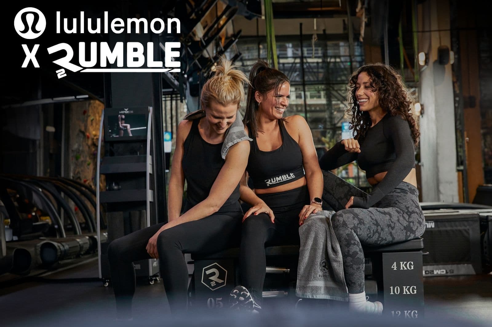 Lululemon × Rumble community shot — three women laughing together mid-workout